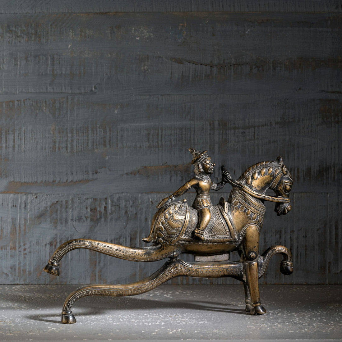 Antique Brass Horse Nutcracker showing mechanical grandeur on a living room coffee table. 