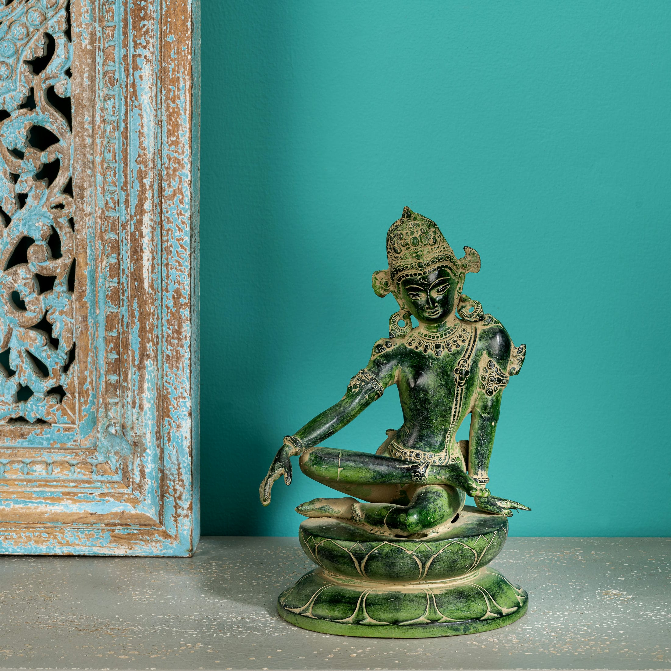 Verdigris finish seated bodhisattva or devi on lotus base
