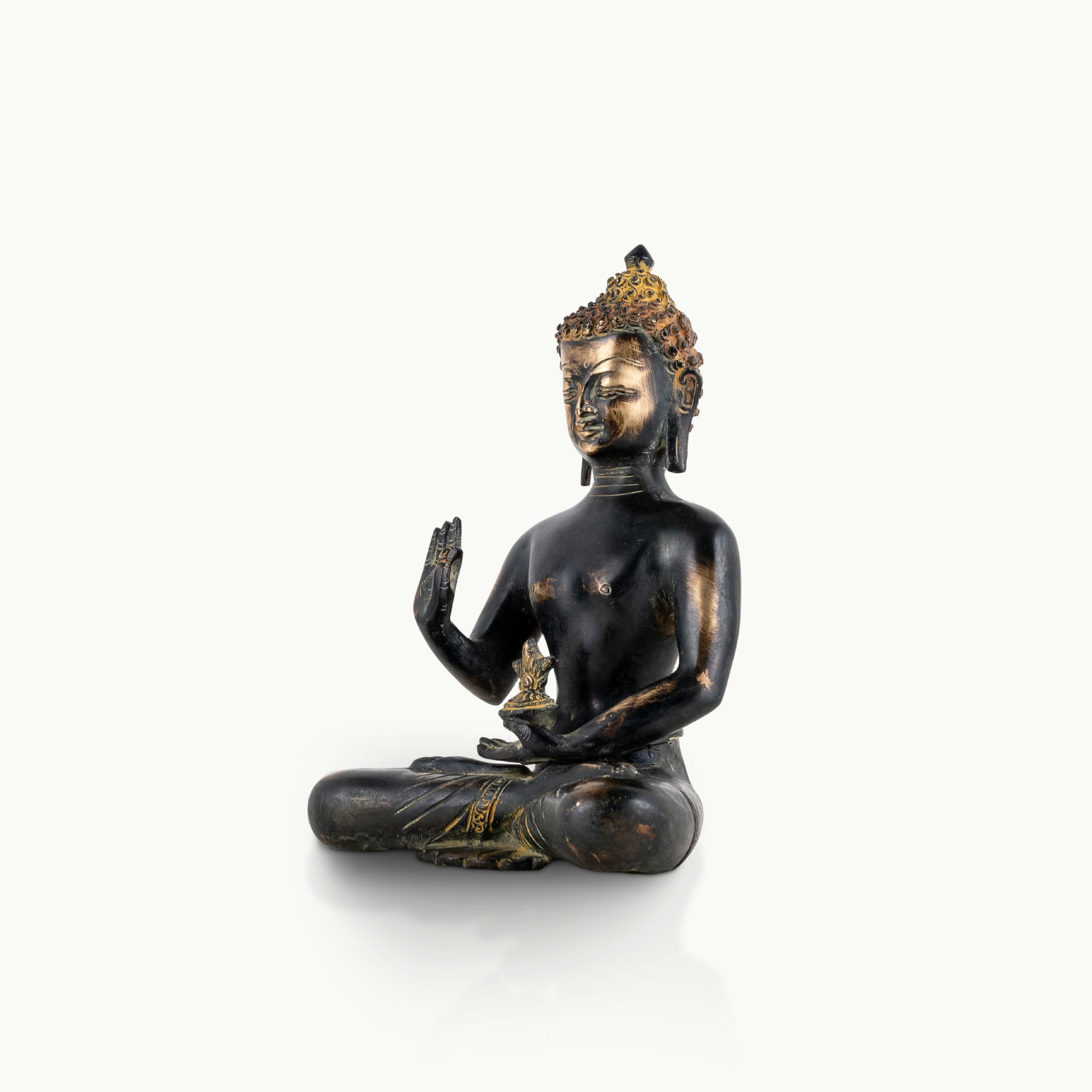 Brass buddha in sitting position