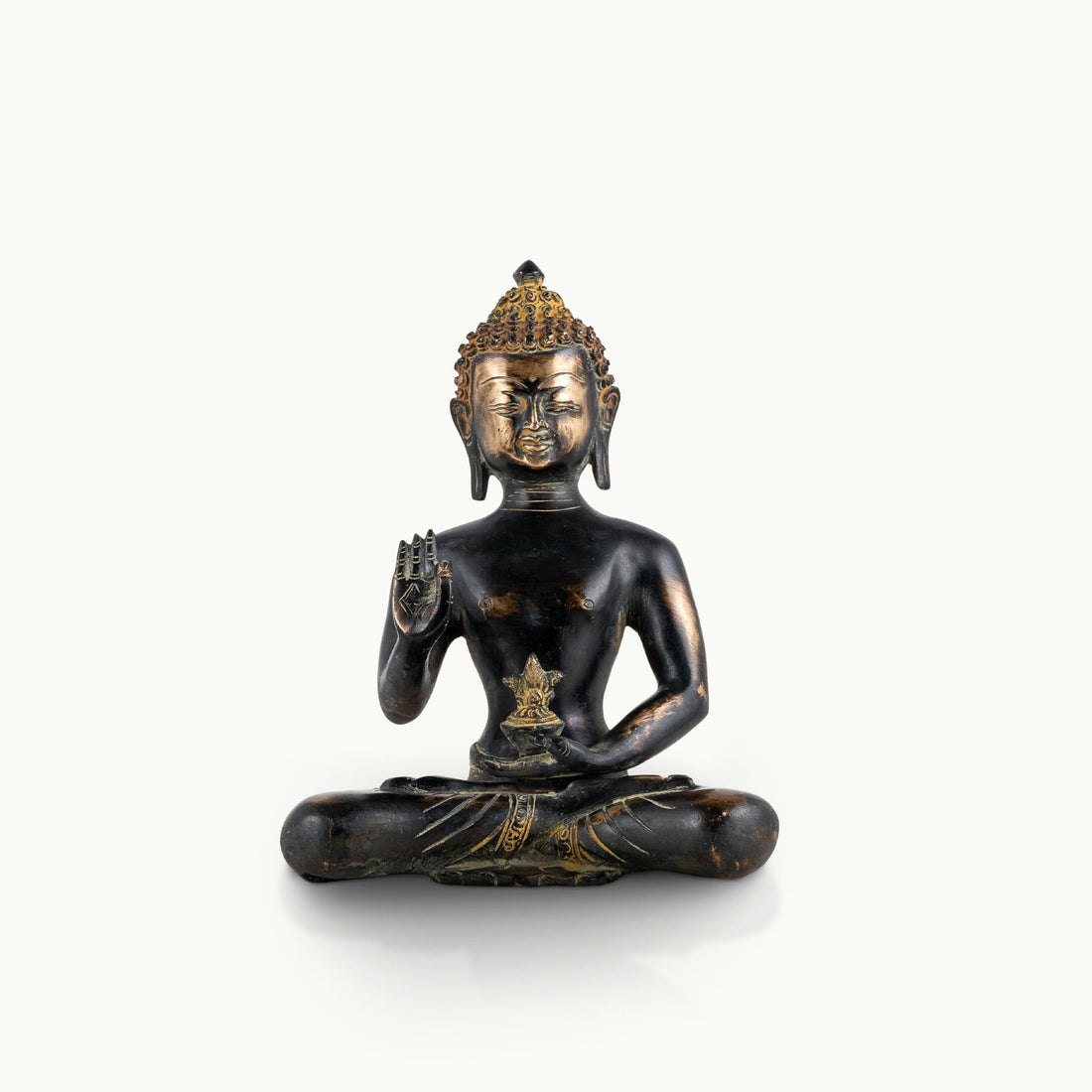 Brass buddha in sitting position