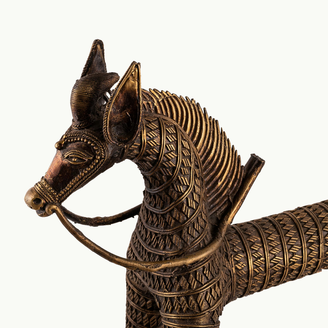 Monumental Antique Brass Horse Sculpture standing rigidly on a reclaimed wood console. 