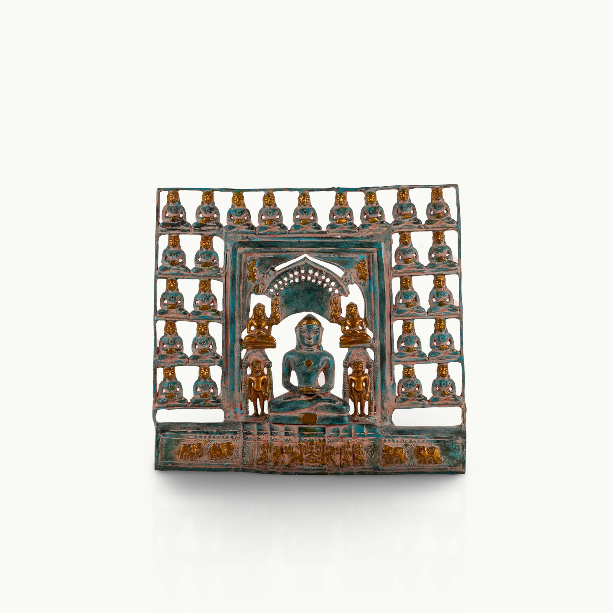Verdigris Brass Tirthankara Panel surrounded by miniature deities on an east-facing puja altar