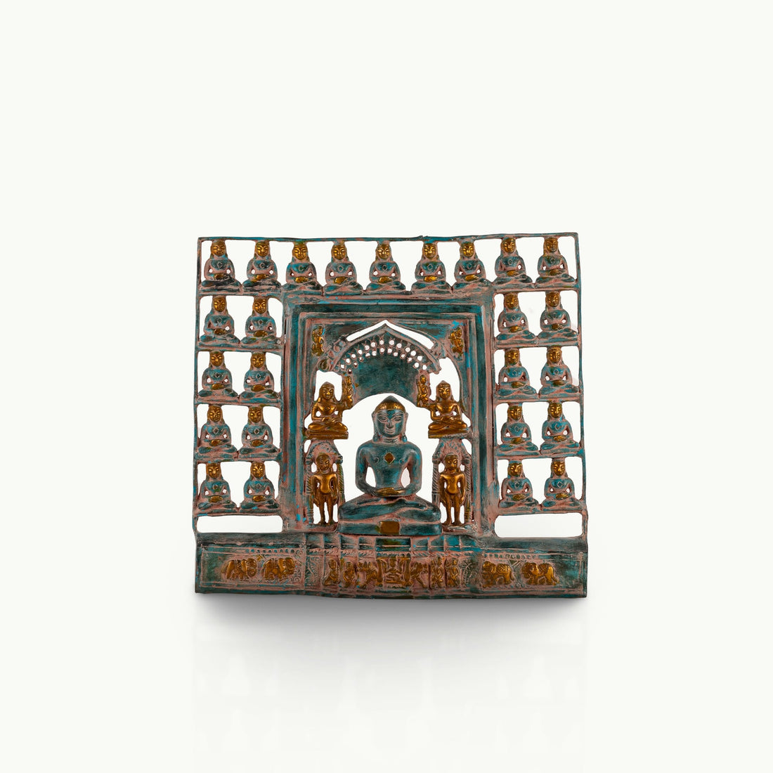 Verdigris Brass Tirthankara Panel surrounded by miniature deities on an east-facing puja altar