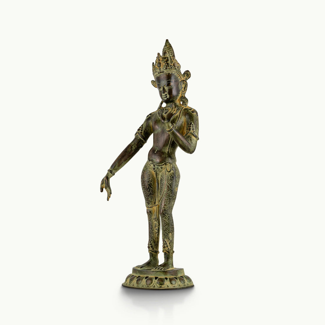 Engraved brass standing Devi statue in a graceful three-bend posture with a chased botanical dhoti.