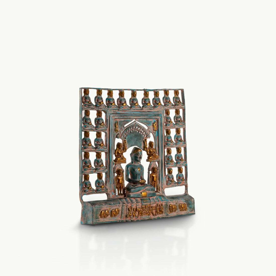 Verdigris Brass Tirthankara Panel surrounded by miniature deities on an east-facing puja altar