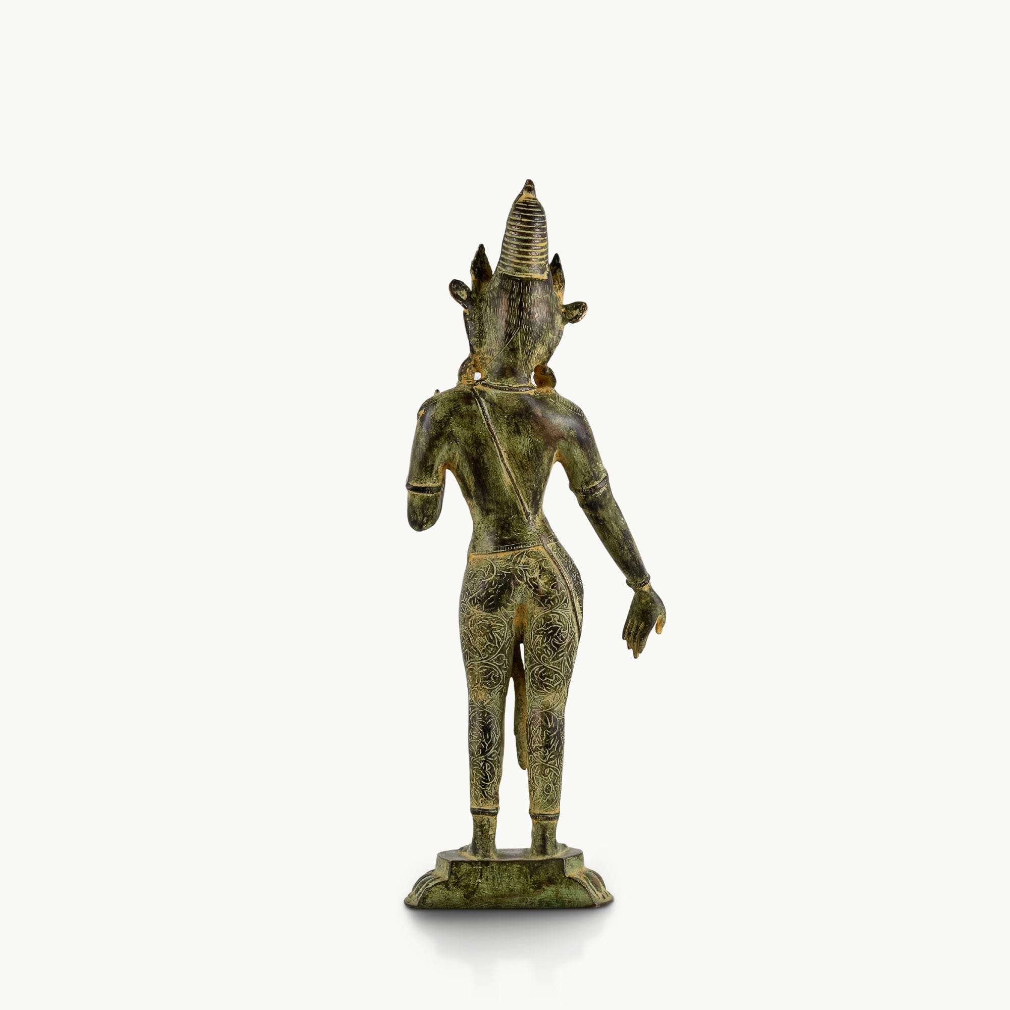 Engraved brass standing Devi statue in a graceful three-bend posture with a chased botanical dhoti.