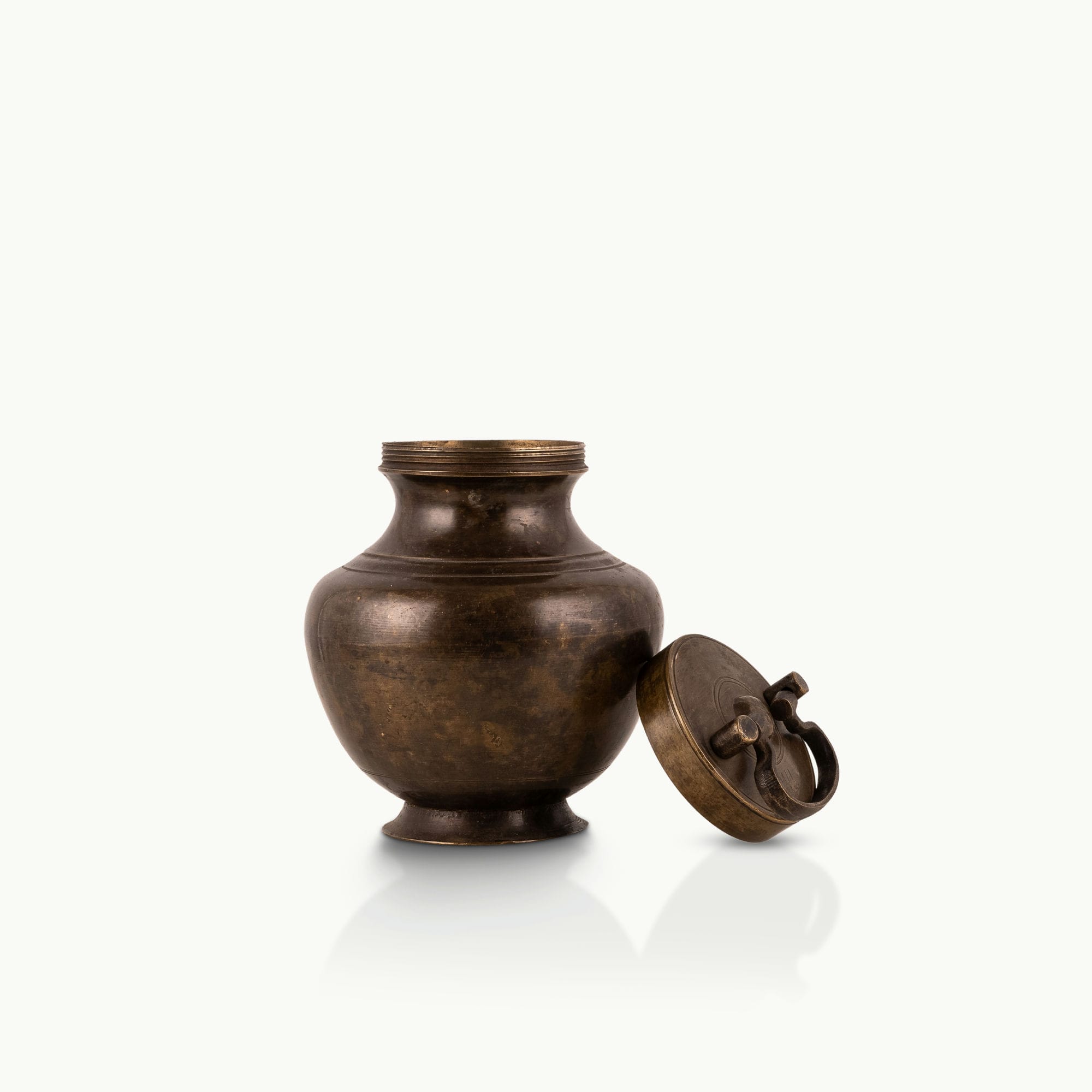 Antique Brass Surma Container with a tiny finger loop for a mirrored dressing tray.