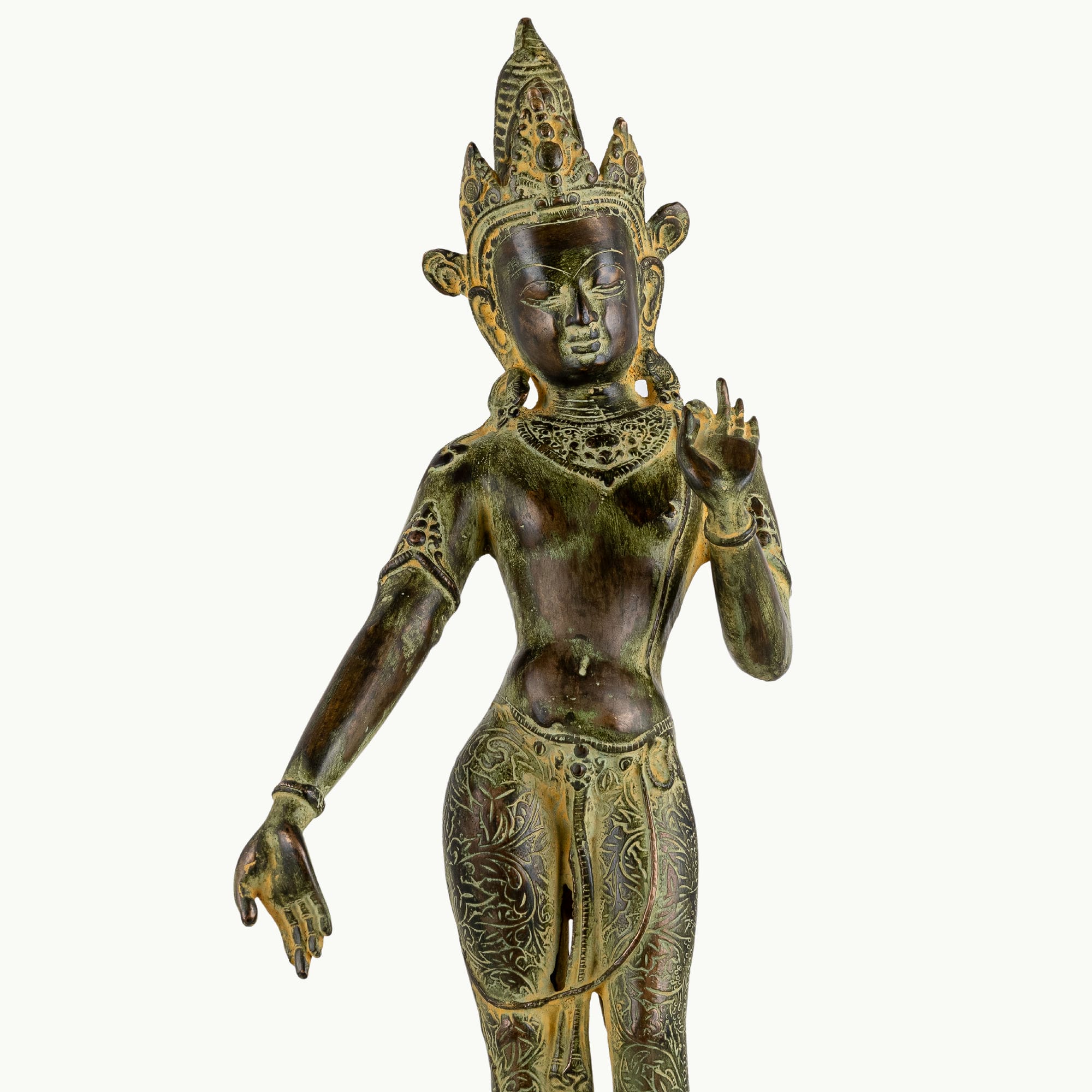 Engraved brass standing Devi statue in a graceful three-bend posture with a chased botanical dhoti.