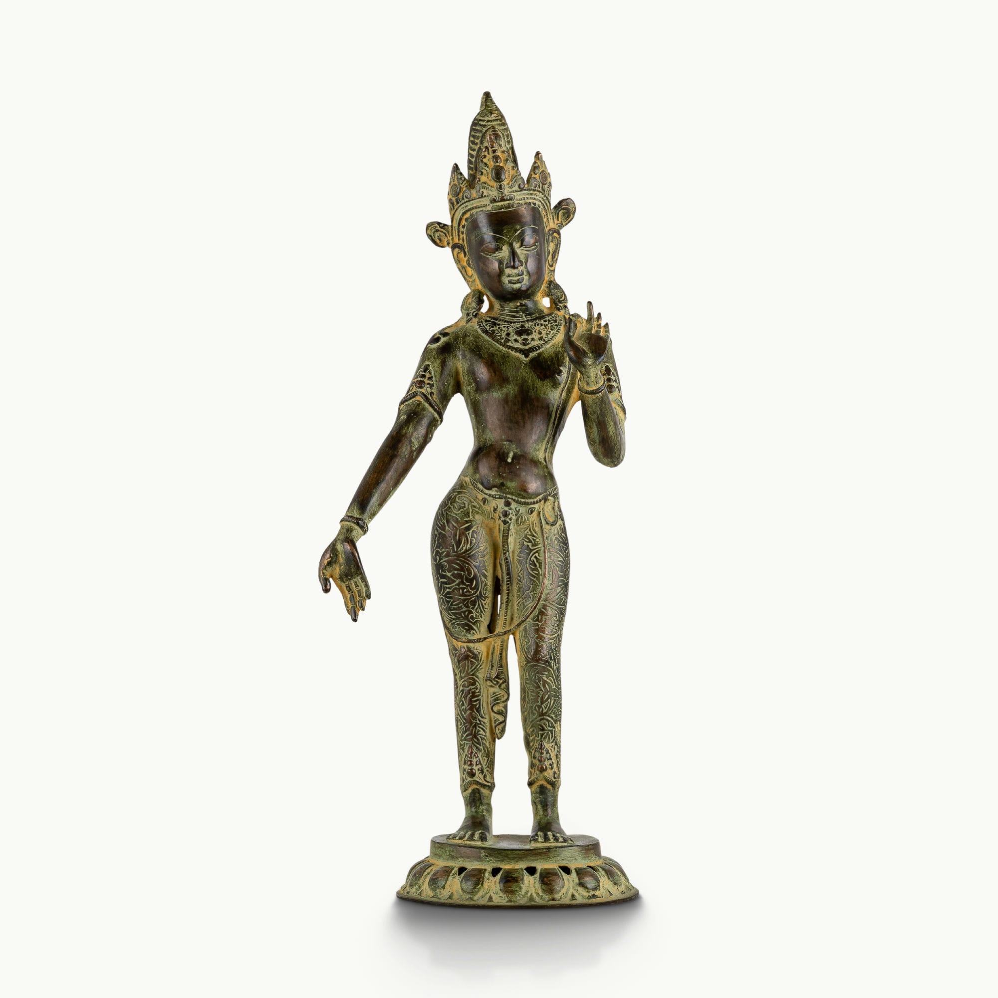 Engraved brass standing Devi statue in a graceful three-bend posture with a chased botanical dhoti.
