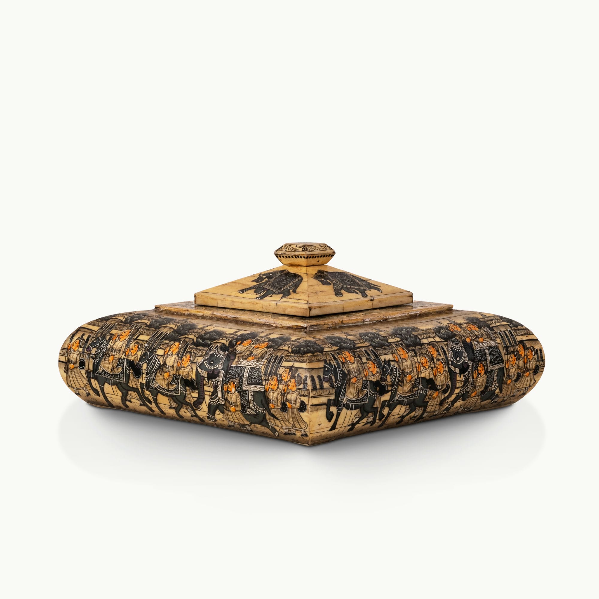 Square painted camel bone box depicting a Rajput royal procession on a dark vanity.
