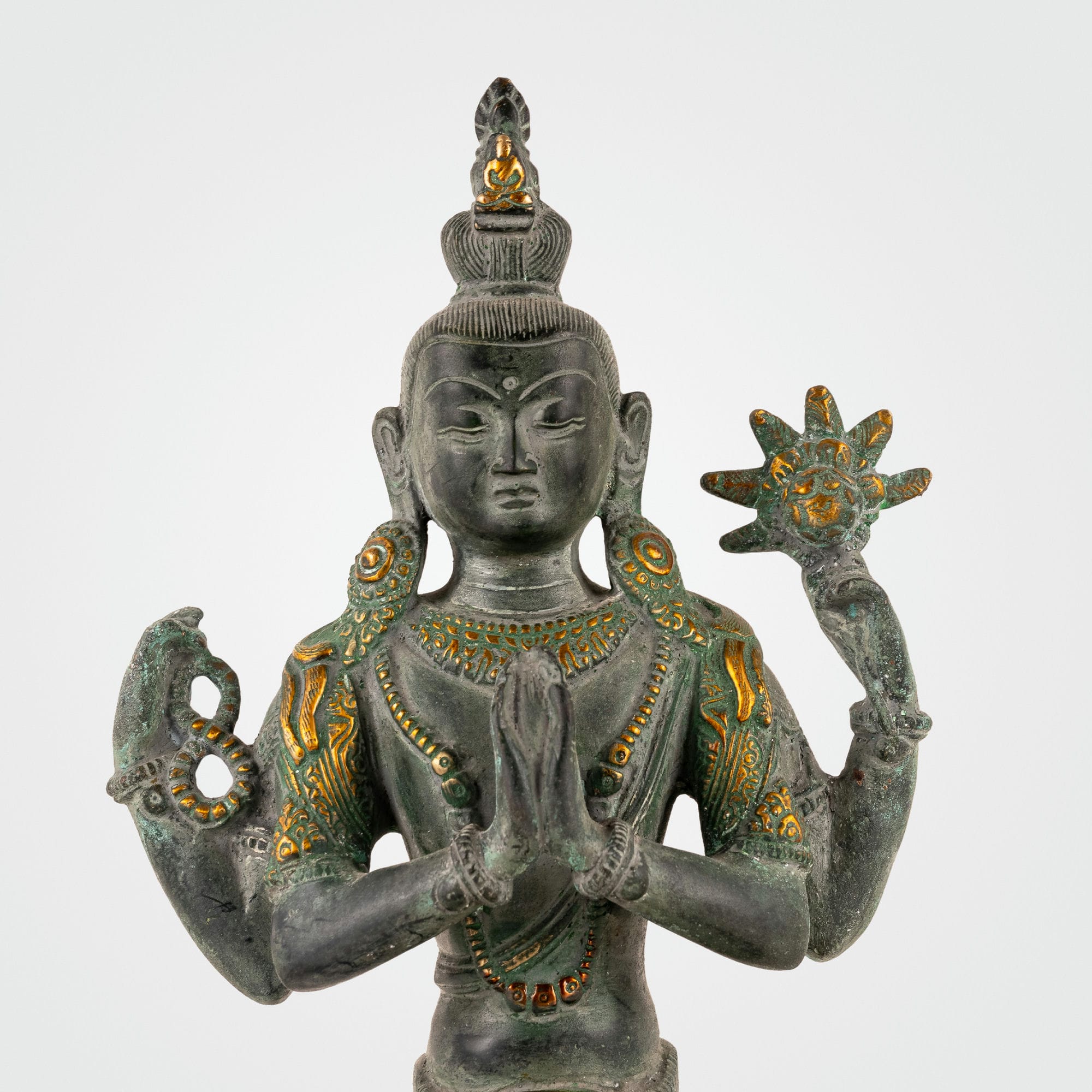 Handcrafted verdigris metal Bodhisattva decor sitting in padmasana for a private study or zen space.