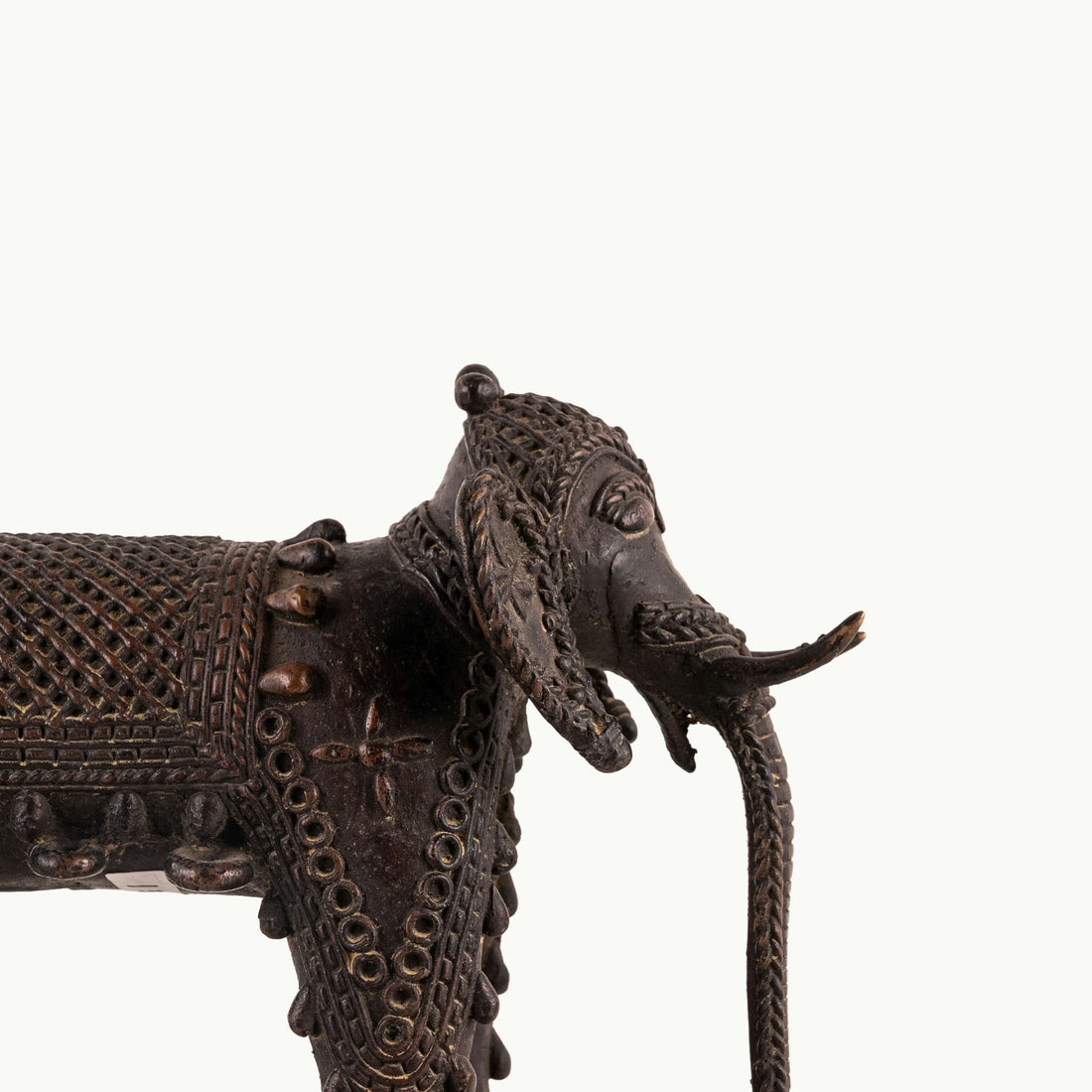 Dhokra Brass Wheeled Elephant ready for a ceremonial procession on a reclaimed wood coffee table. 