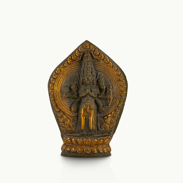 11-Headed Brass Avalokiteshvara Statue standing upright on a west-facing meditation altar. 