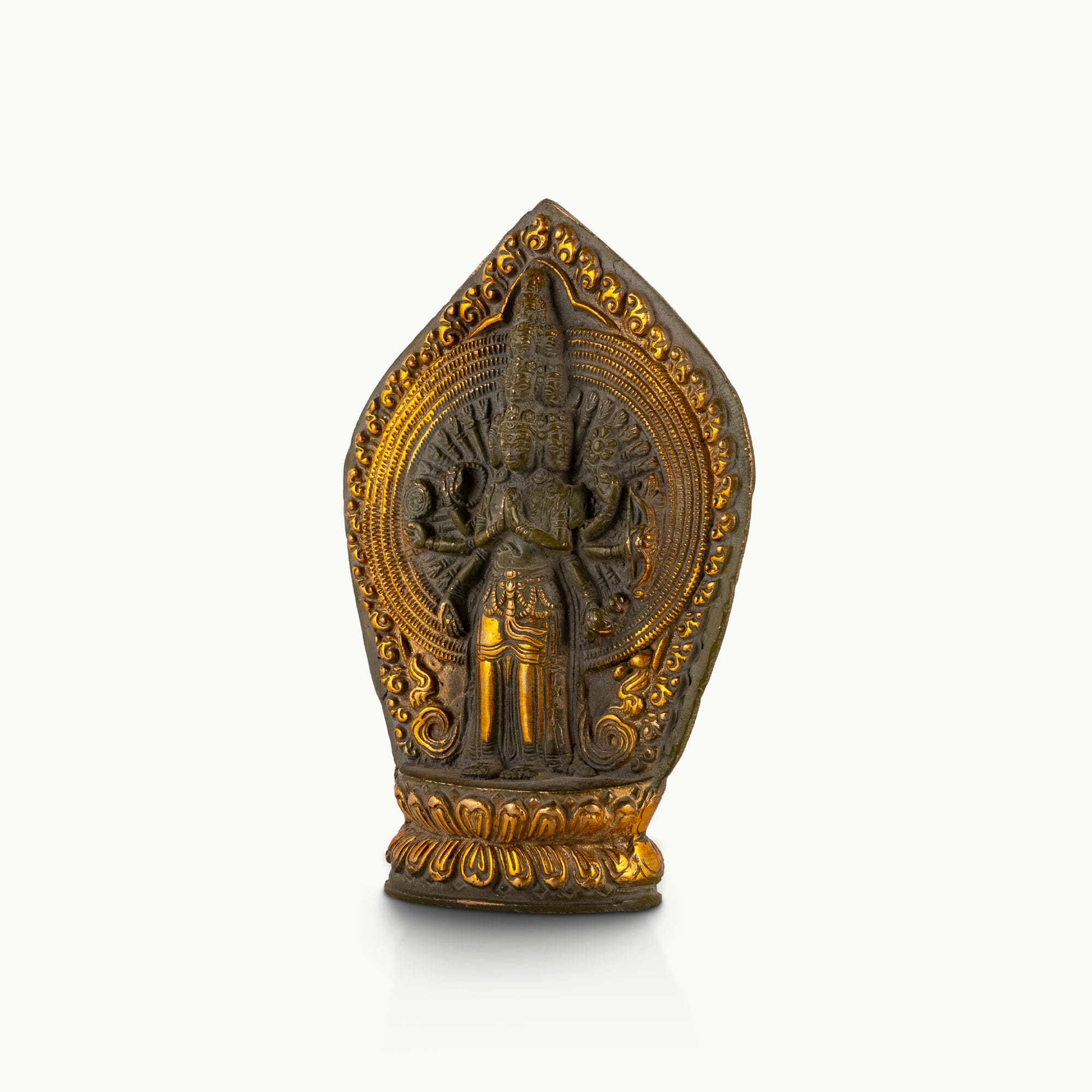 11-Headed Brass Avalokiteshvara Statue standing upright on a west-facing meditation altar. 
