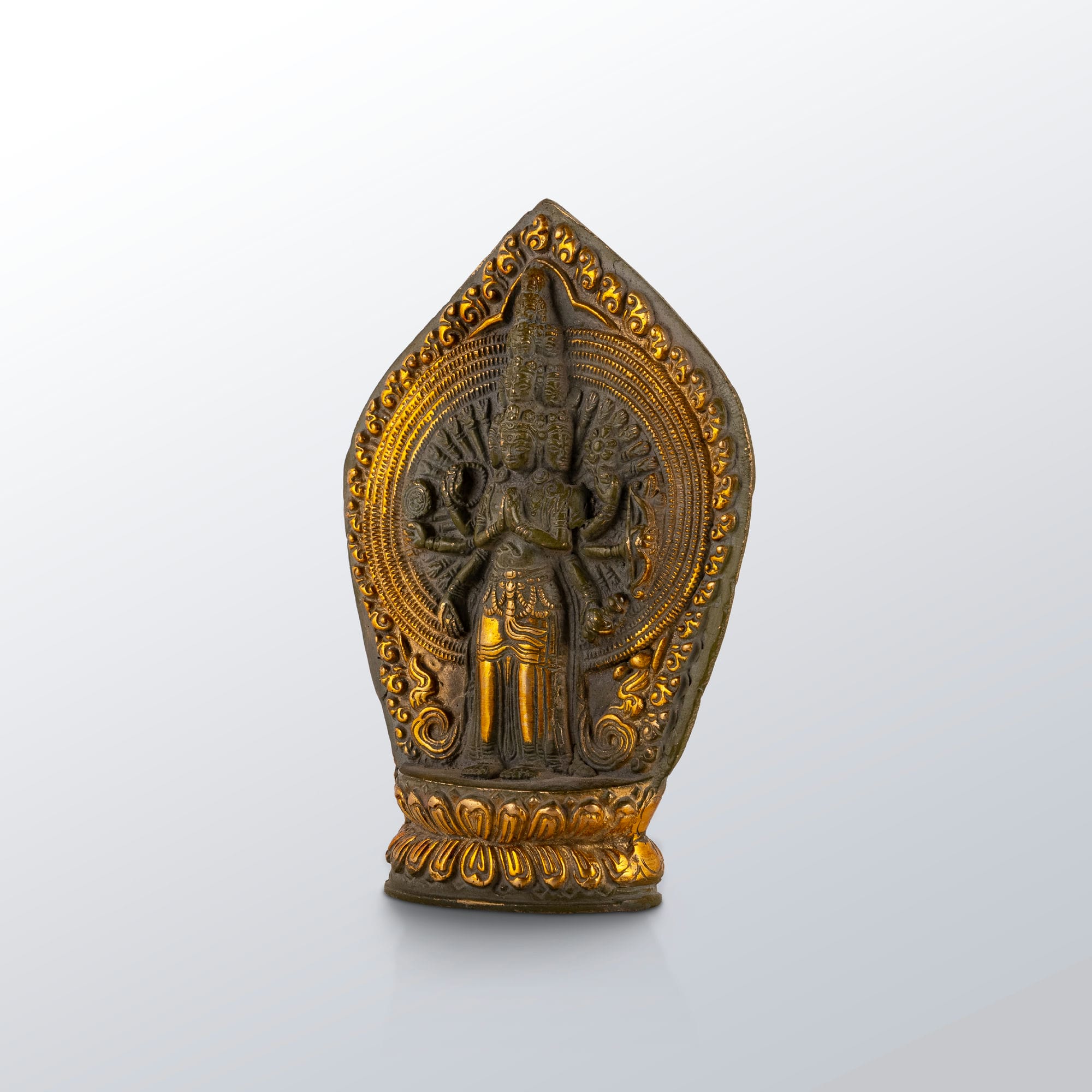 11-Headed Brass Avalokiteshvara Statue standing upright on a west-facing meditation altar. 