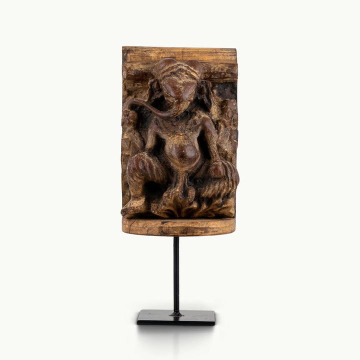 Wood finish marble dust Ganesha sculpture mounted on an iron stand.