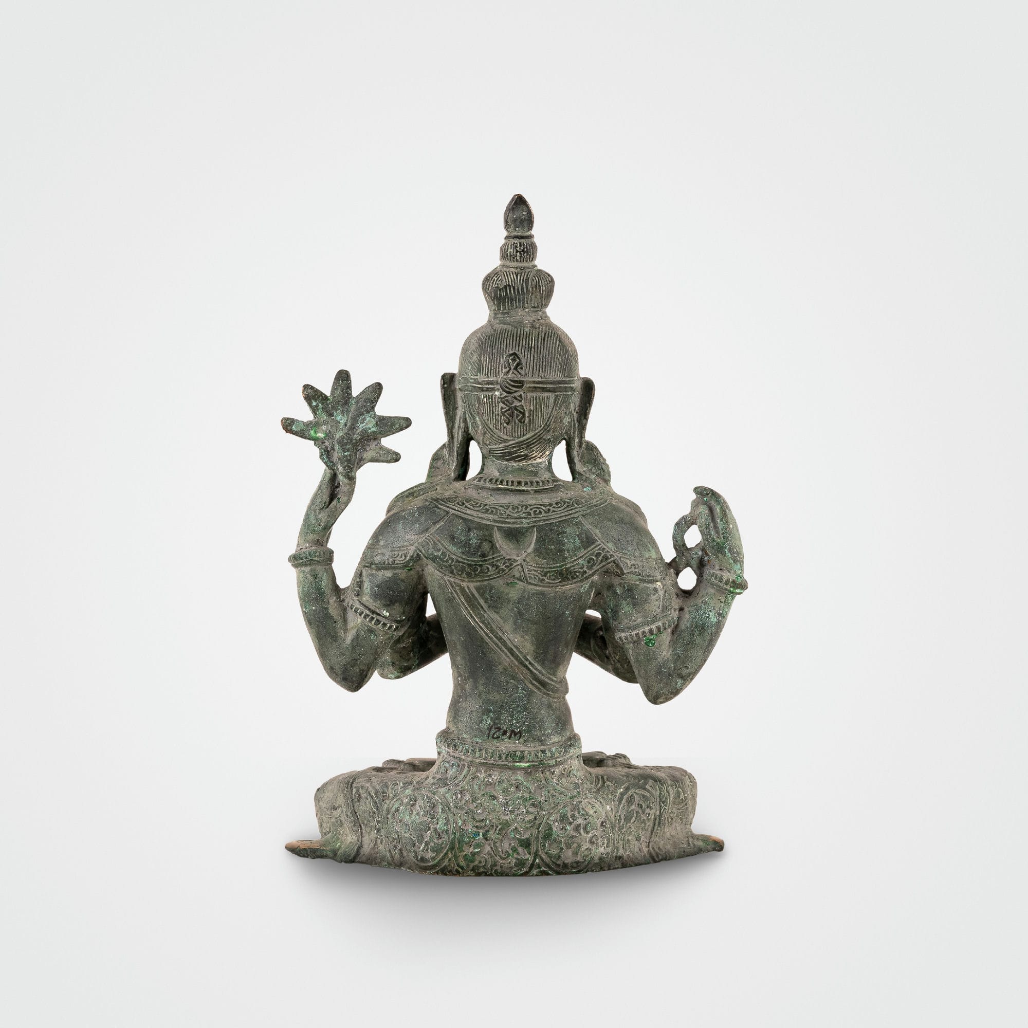 Handcrafted verdigris metal Bodhisattva decor sitting in padmasana for a private study or zen space.