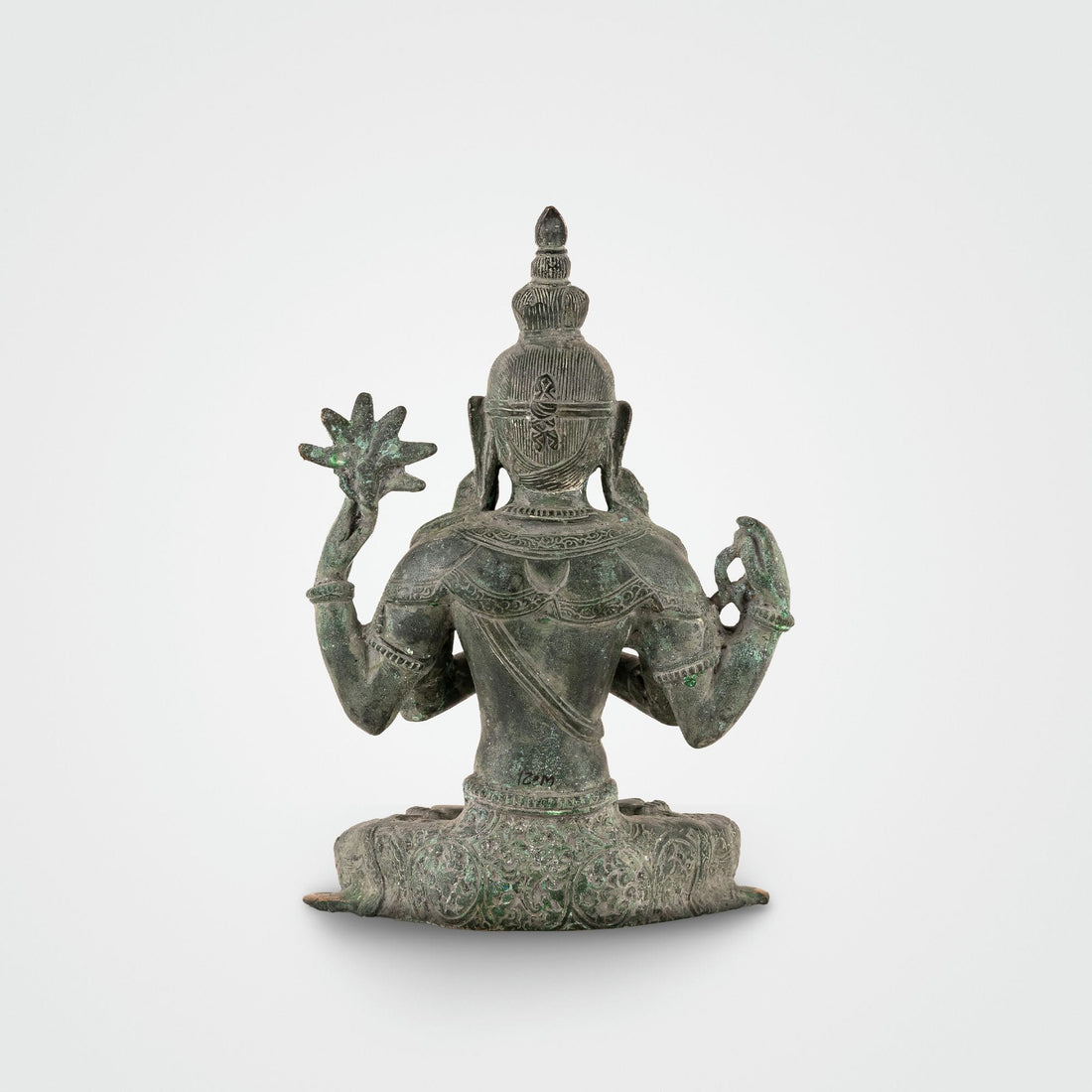 Handcrafted verdigris metal Bodhisattva decor sitting in padmasana for a private study or zen space.