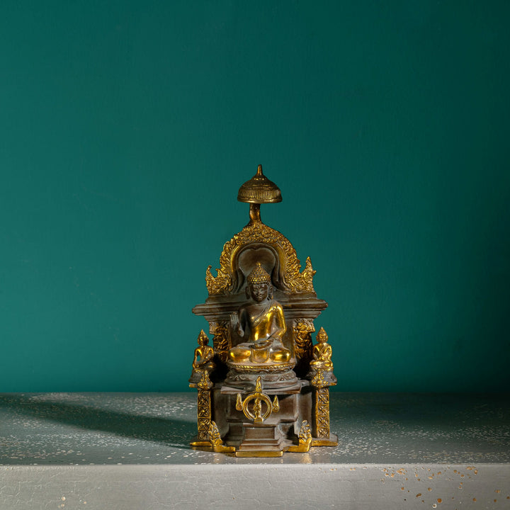 Antique Brass Buddha Shrine sheltered by a ceremonial parasol on a west-facing meditation altar. 