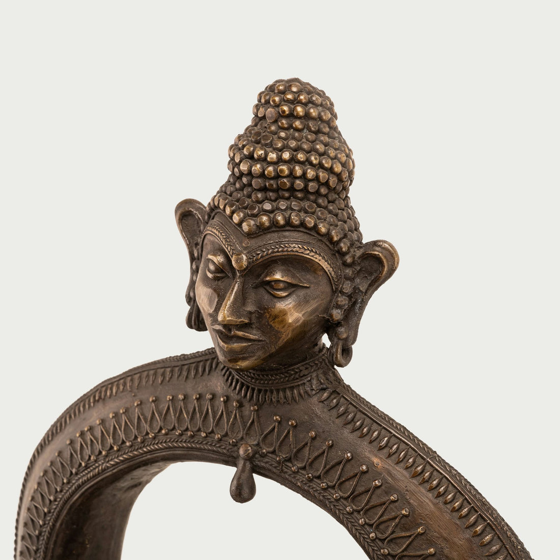 Cosmic enlightened figure decor seating a smaller meditating monk within an arch for a dedicated meditation room or zen garden.