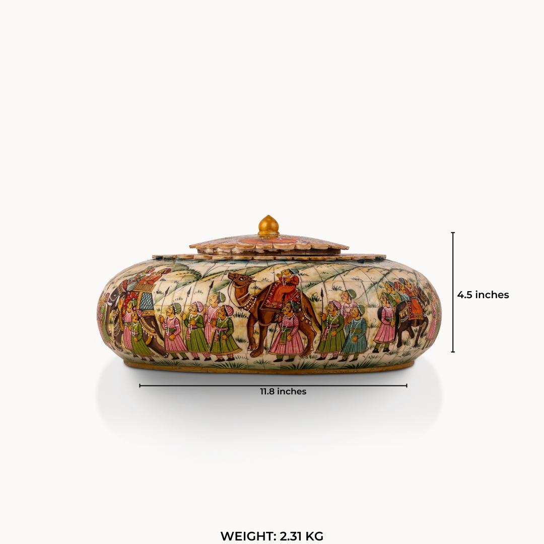 Wide painted camel bone caravan box showing a detailed royal procession scene with emerald and magenta accents.