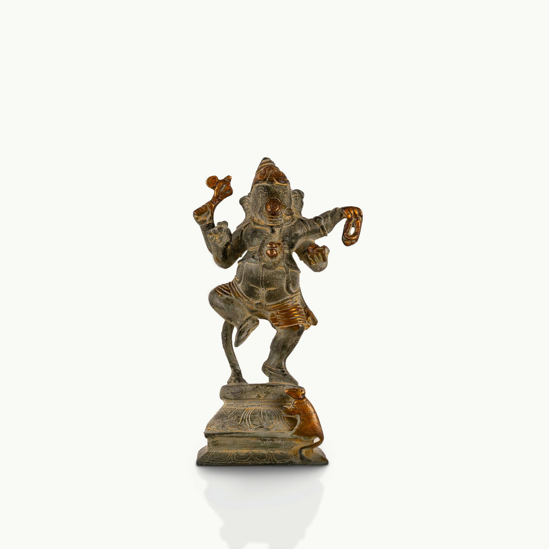 Verdigris Brass Dancing Ganesha Statue balancing effortlessly on a prominent entryway console. 