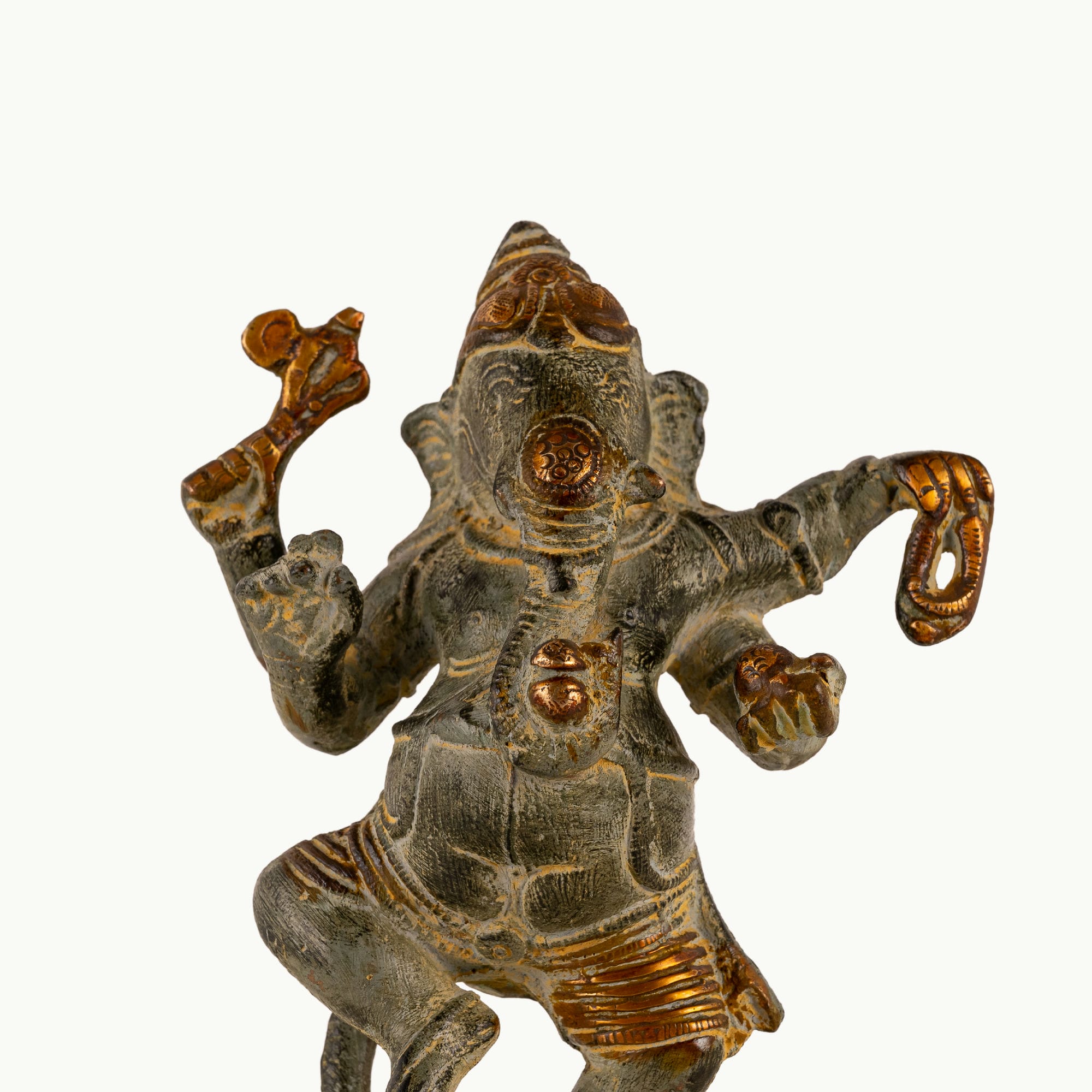 Verdigris Brass Dancing Ganesha Statue balancing effortlessly on a prominent entryway console. 