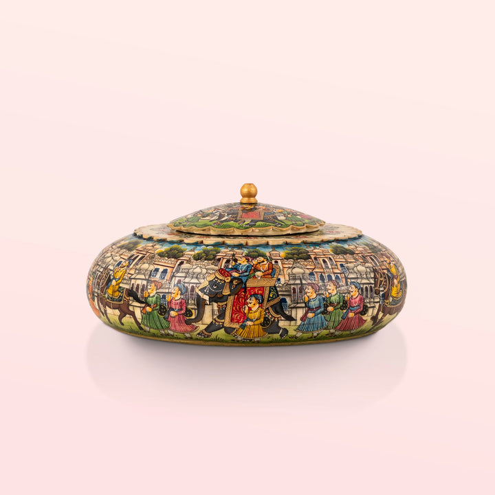 Painted domed camel bone box featuring a vivid royal procession scene against a sky-blue background.