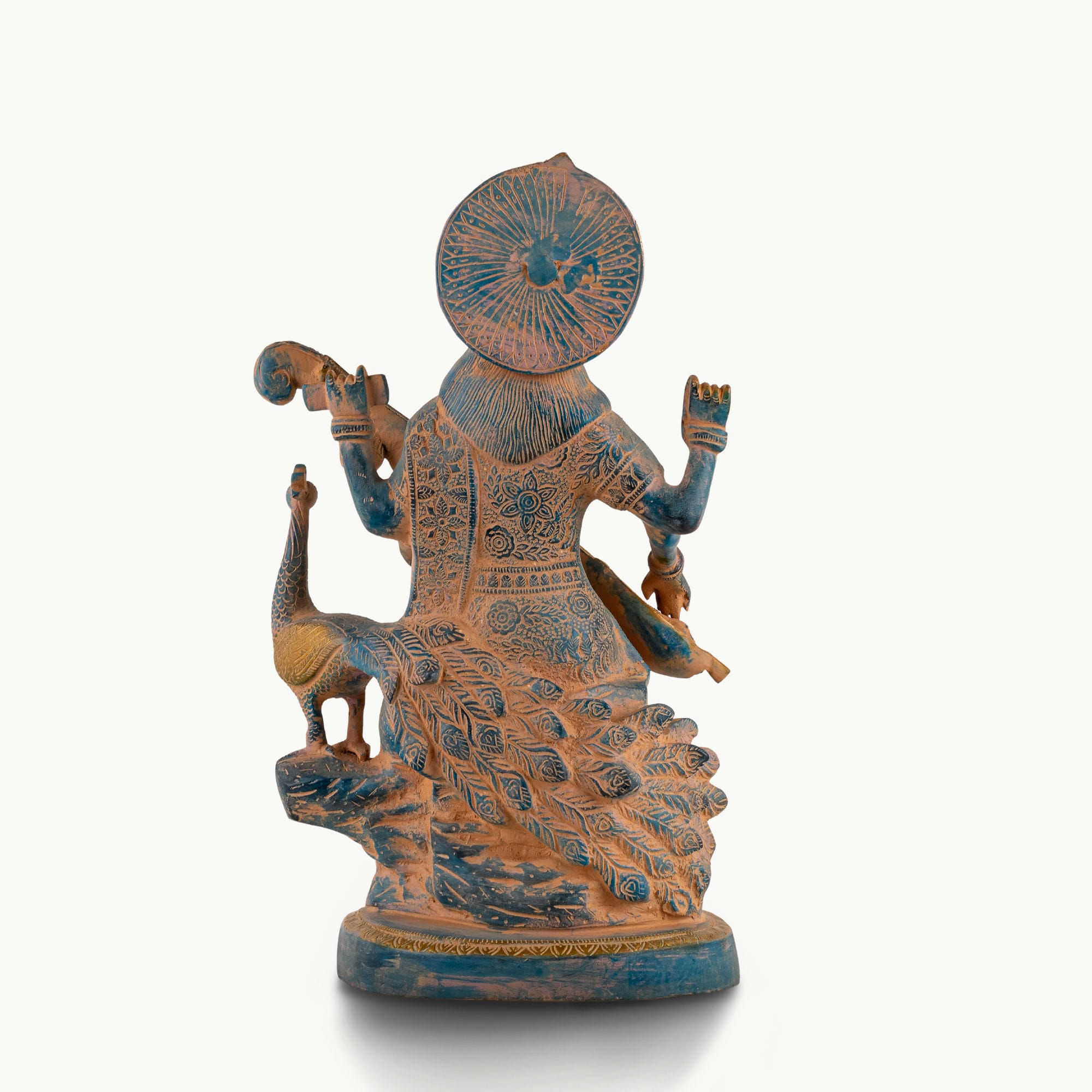 Dual-Tone Brass Saraswati Statue cradling a veena gracefully on a dedicated library console. 