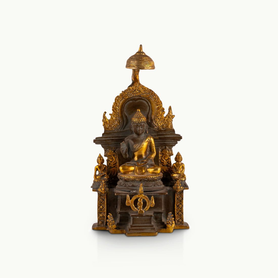 Antique Brass Buddha Shrine sheltered by a ceremonial parasol on a west-facing meditation altar. 