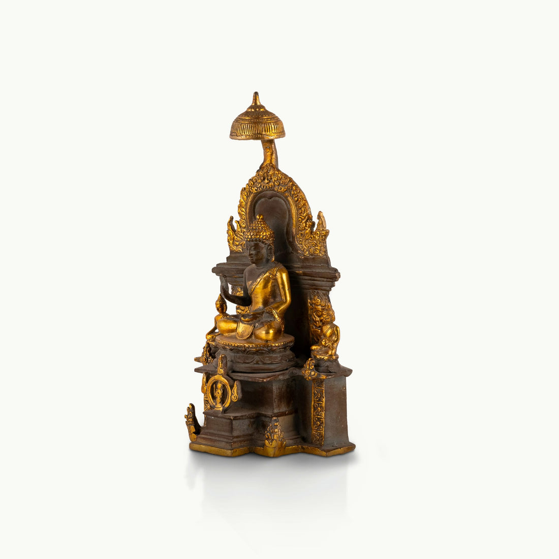 Antique Brass Buddha Shrine sheltered by a ceremonial parasol on a west-facing meditation altar. 