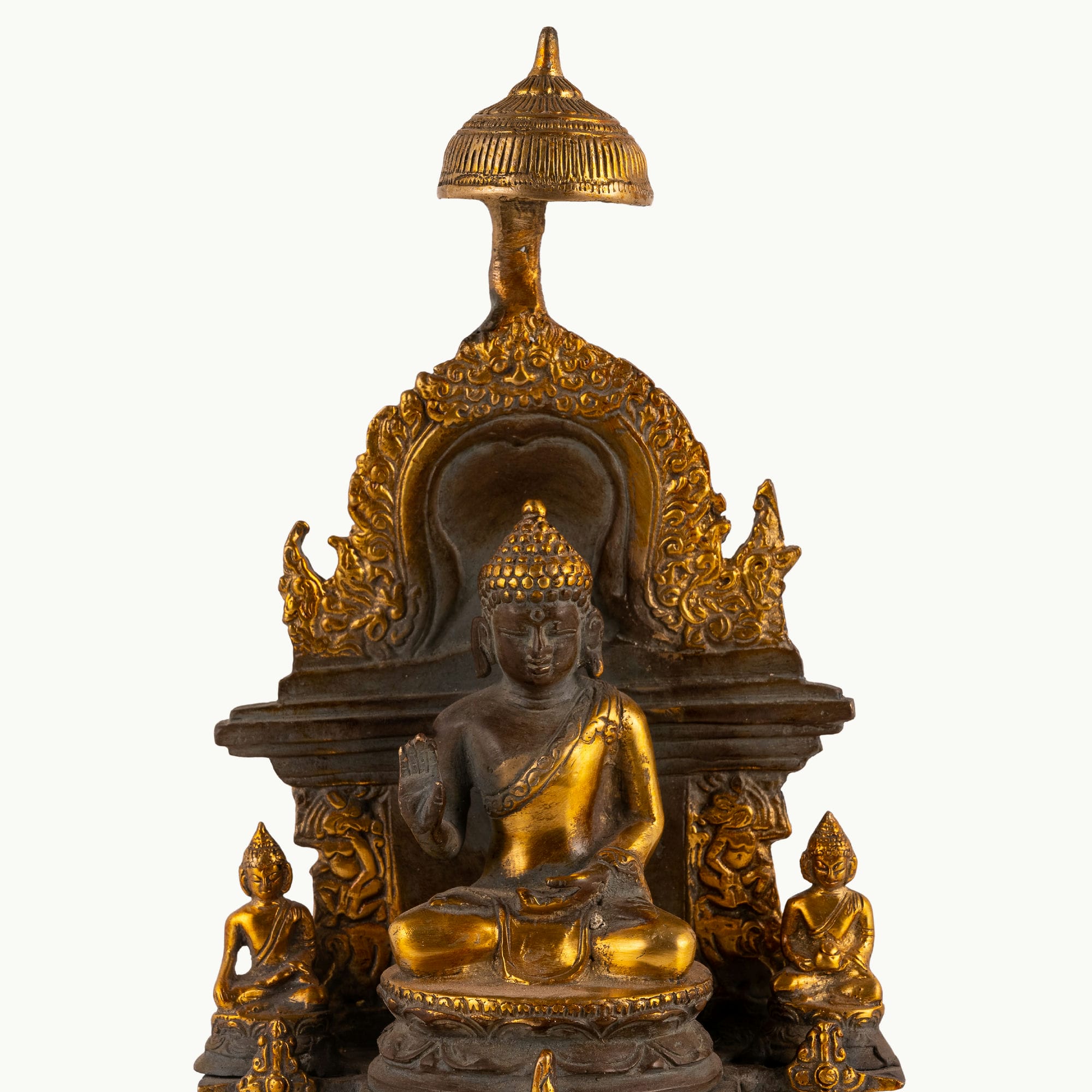 Antique Brass Buddha Shrine sheltered by a ceremonial parasol on a west-facing meditation altar. 