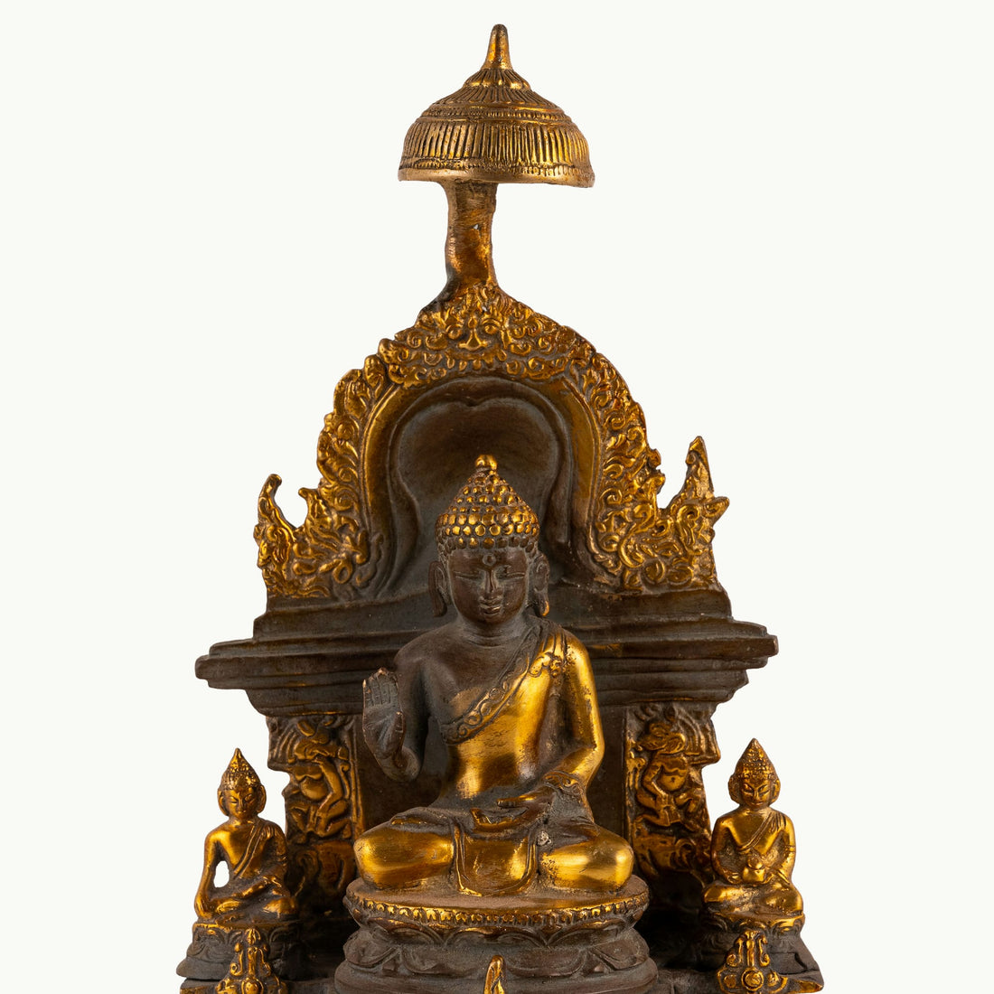 Antique Brass Buddha Shrine sheltered by a ceremonial parasol on a west-facing meditation altar. 