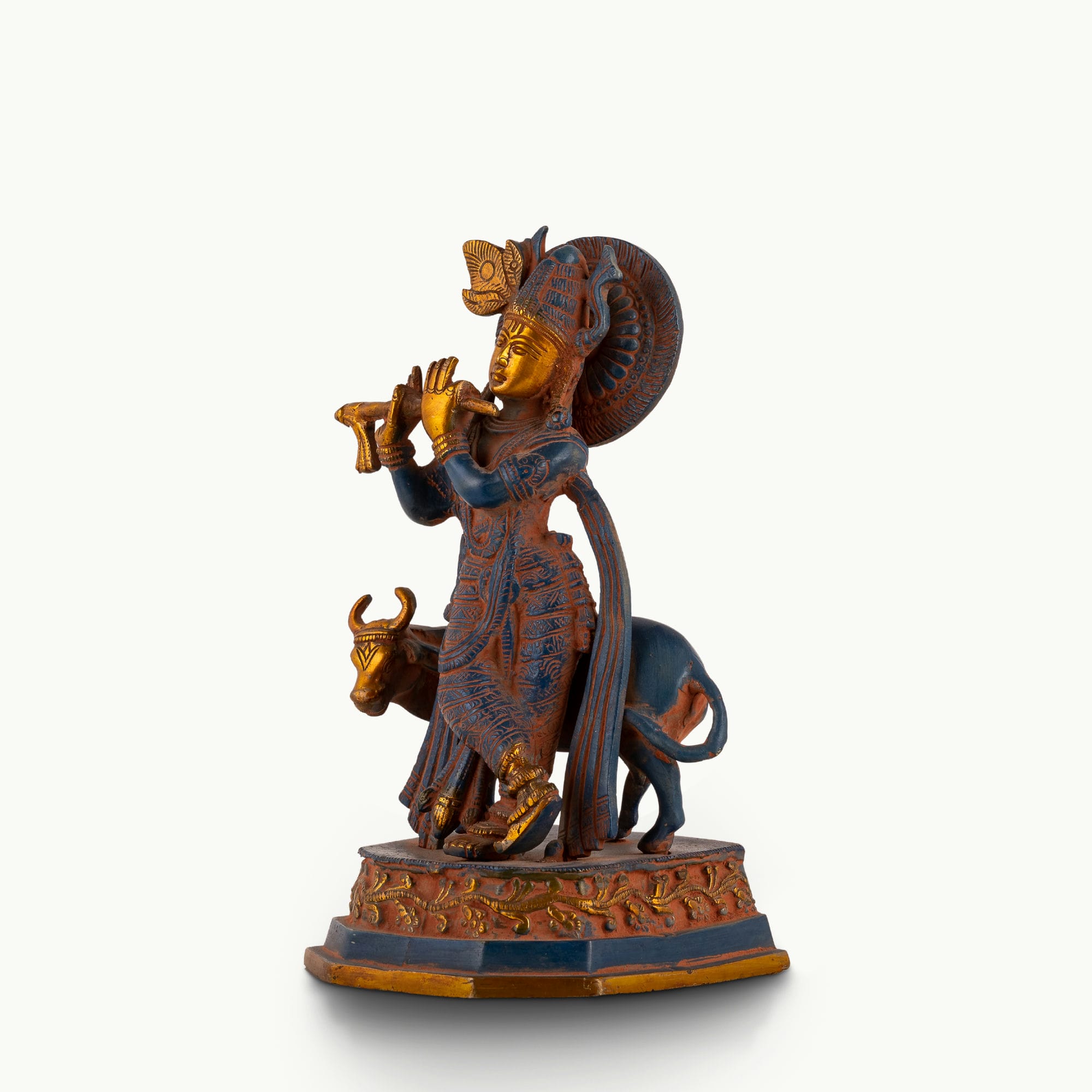 Black Brass Tribal Head Sculpture projecting an ancestral presence on a floating gallery shelf. 