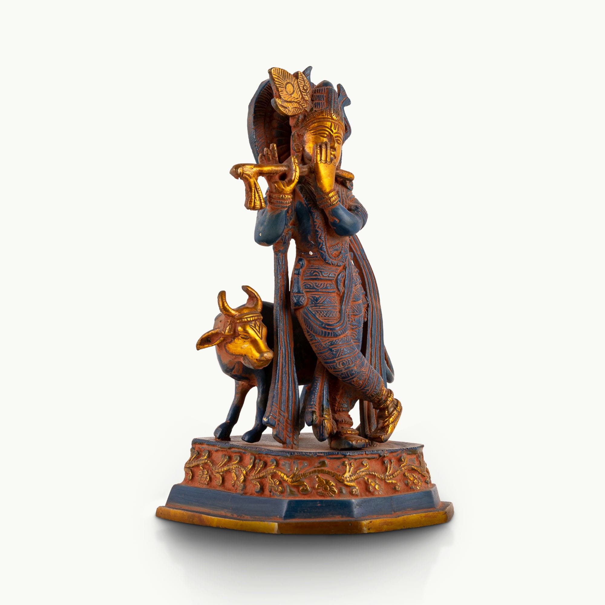 Black Brass Tribal Head Sculpture projecting an ancestral presence on a floating gallery shelf. 
