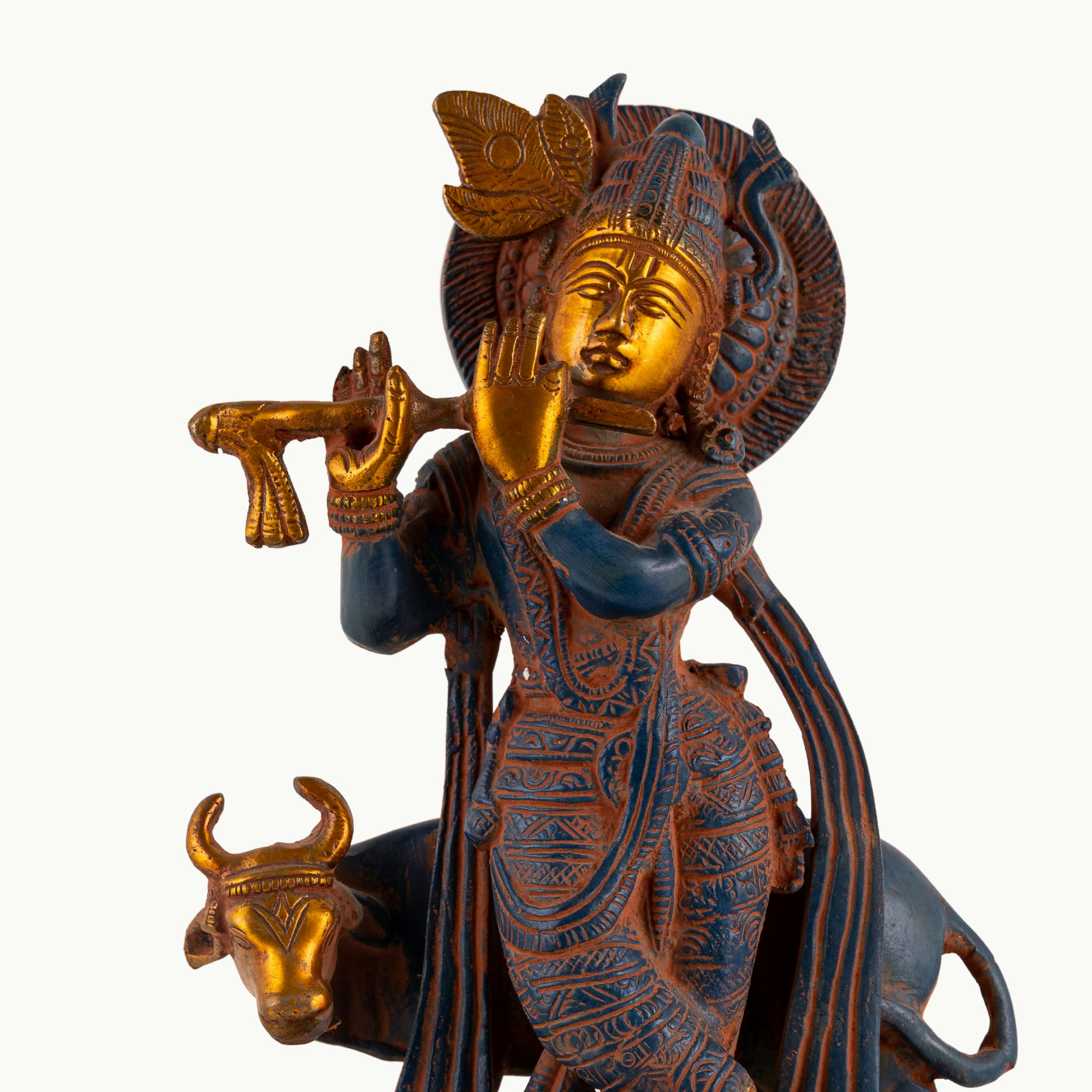 Black Brass Tribal Head Sculpture projecting an ancestral presence on a floating gallery shelf. 