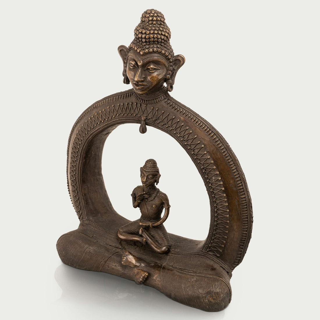 Cosmic enlightened figure decor seating a smaller meditating monk within an arch for a dedicated meditation room or zen garden.
