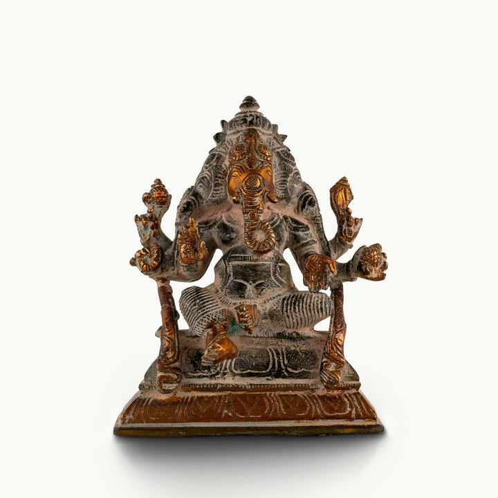 Dual-Tone Brass Ganesha Statue seated in Lalitasana for an east-facing puja altar. 