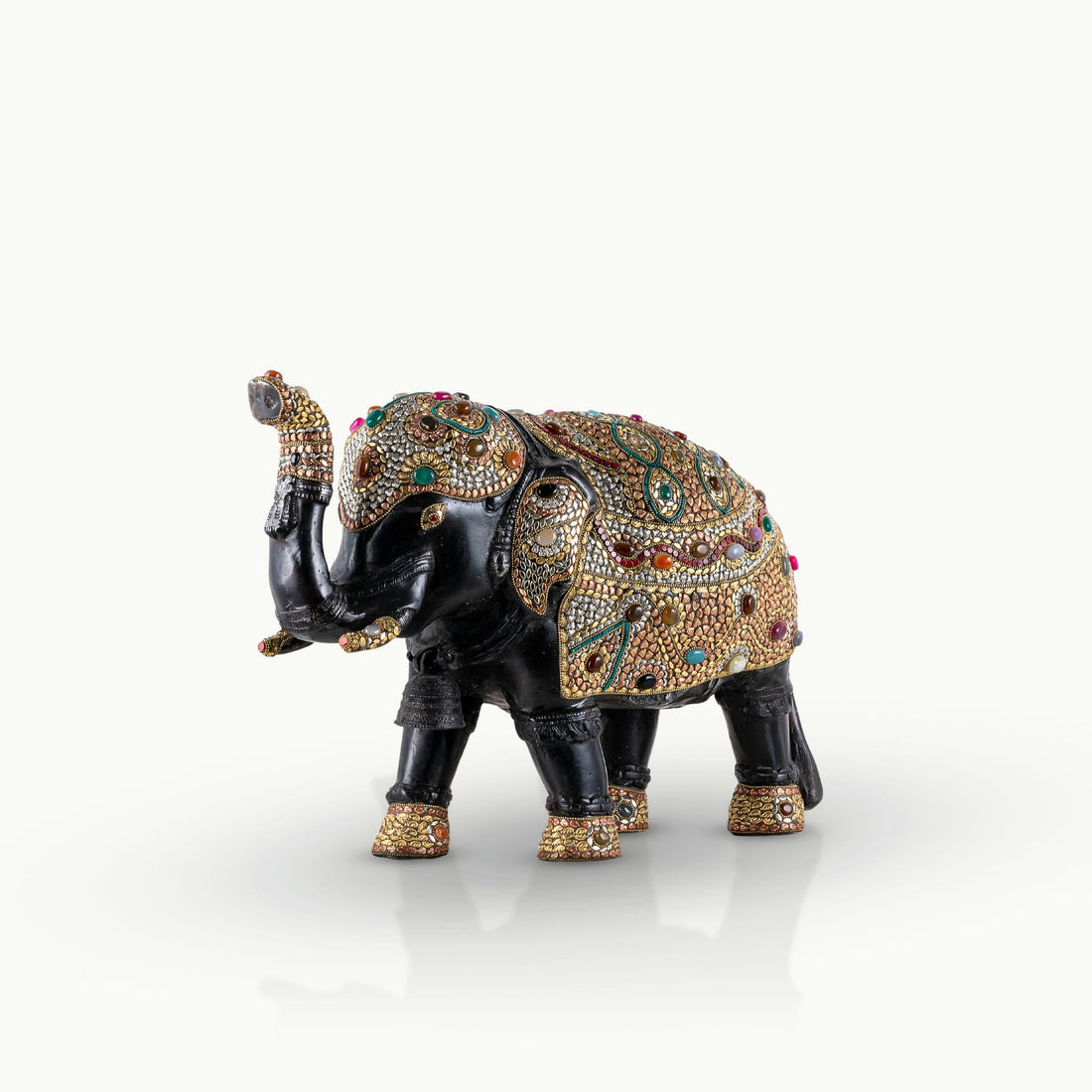 Stone inlay brass elephant sculpture featuring turquoise and lapis accents.