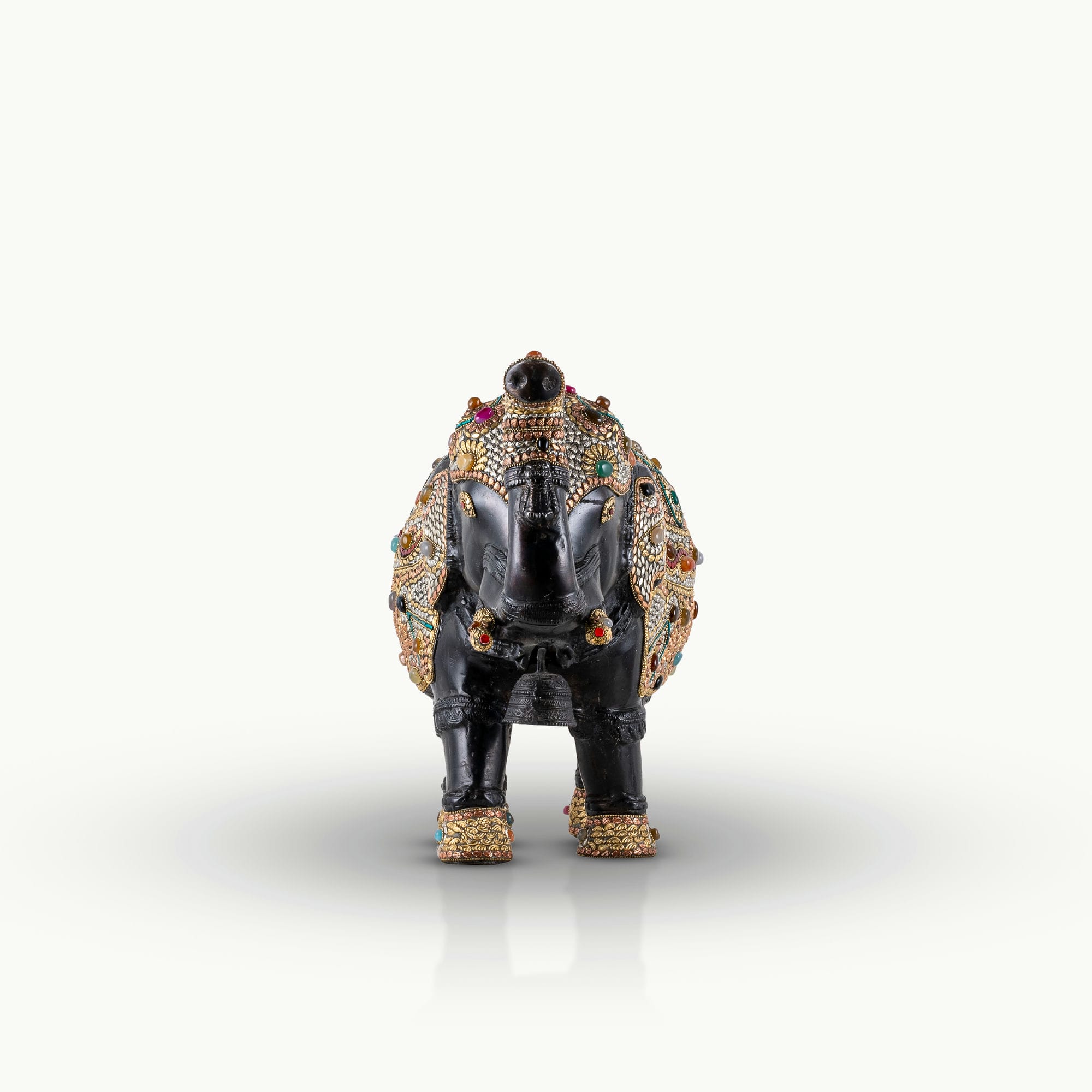 Stone inlay brass elephant sculpture featuring turquoise and lapis accents.