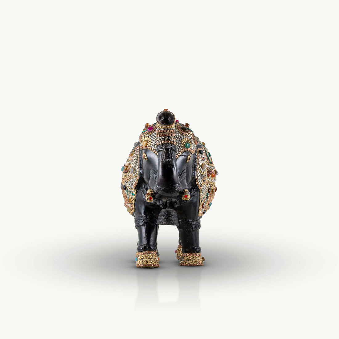 Stone inlay brass elephant sculpture featuring turquoise and lapis accents.