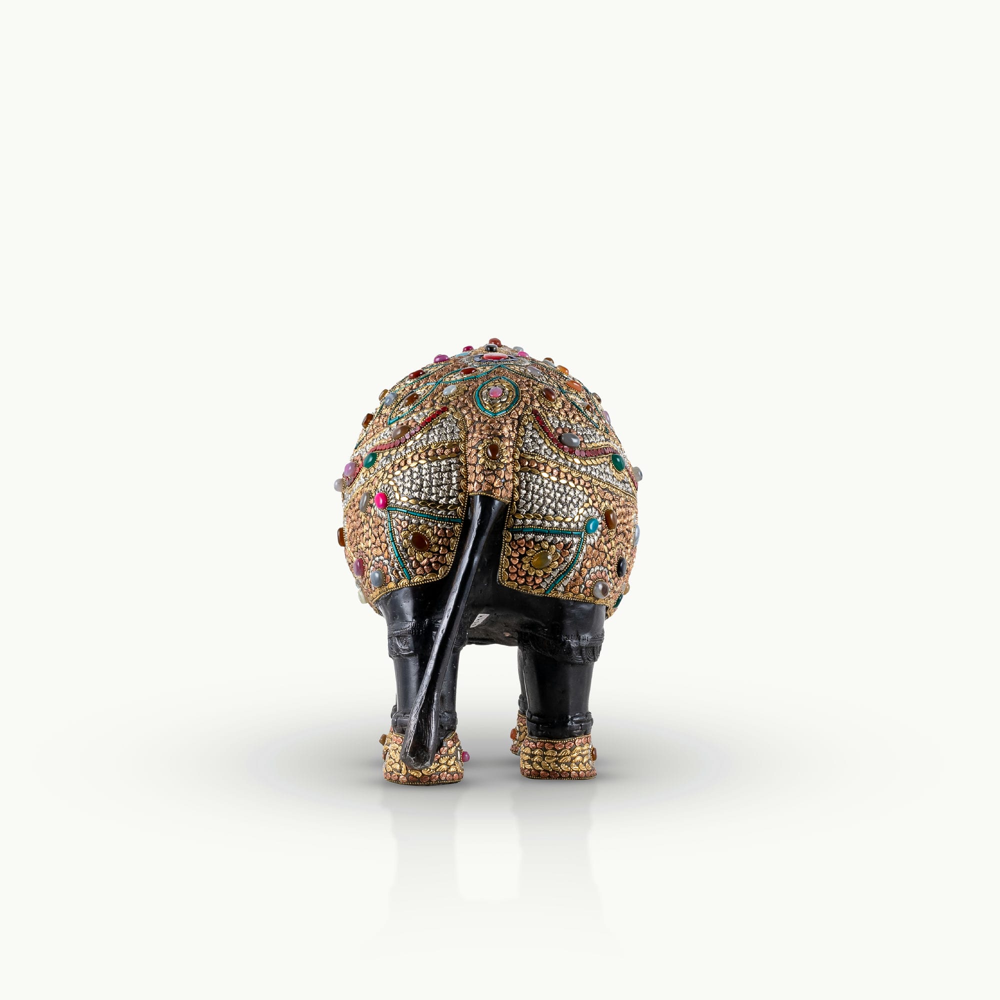 Stone inlay brass elephant sculpture featuring turquoise and lapis accents.