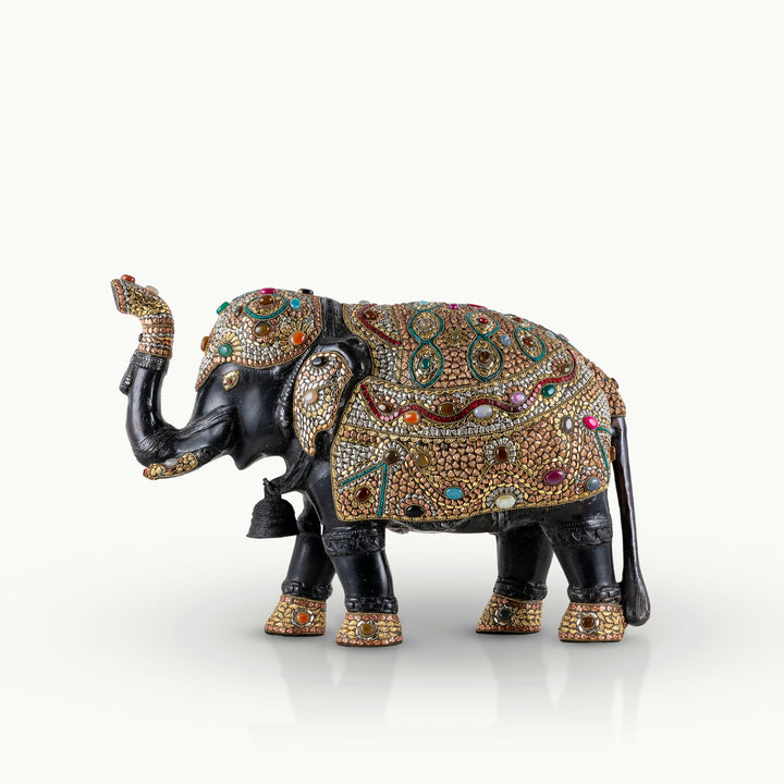 Stone inlay brass elephant sculpture featuring turquoise and lapis accents.