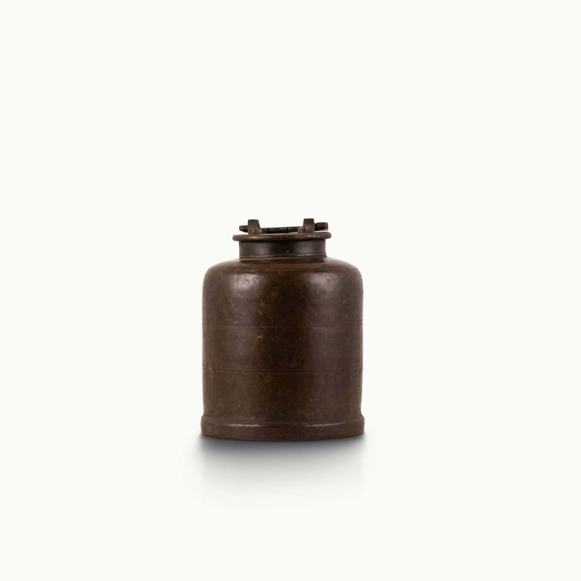 Antique Brass Canister secured by mechanical latches for a wood sideboard.