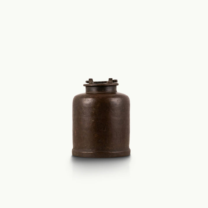 Antique Brass Canister secured by mechanical latches for a wood sideboard.