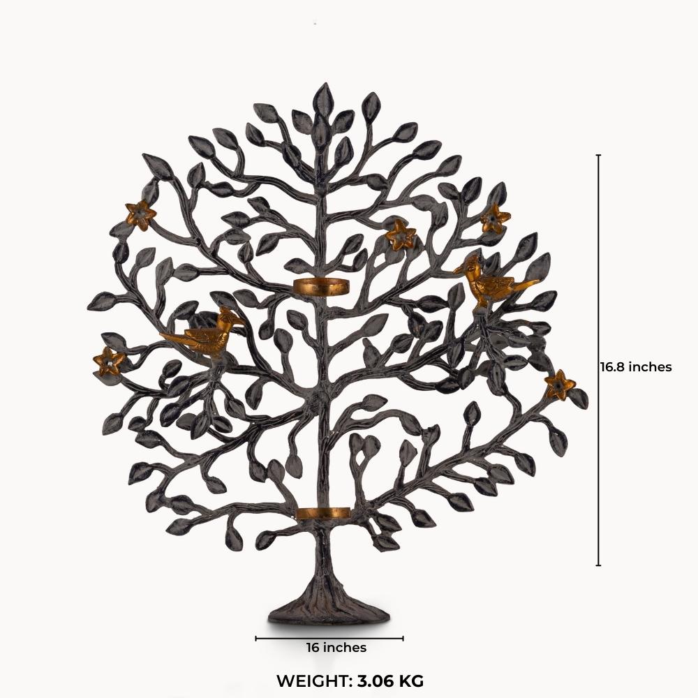 Dual-tone brass tree tealight holder with dark oxidized branches and golden birds.