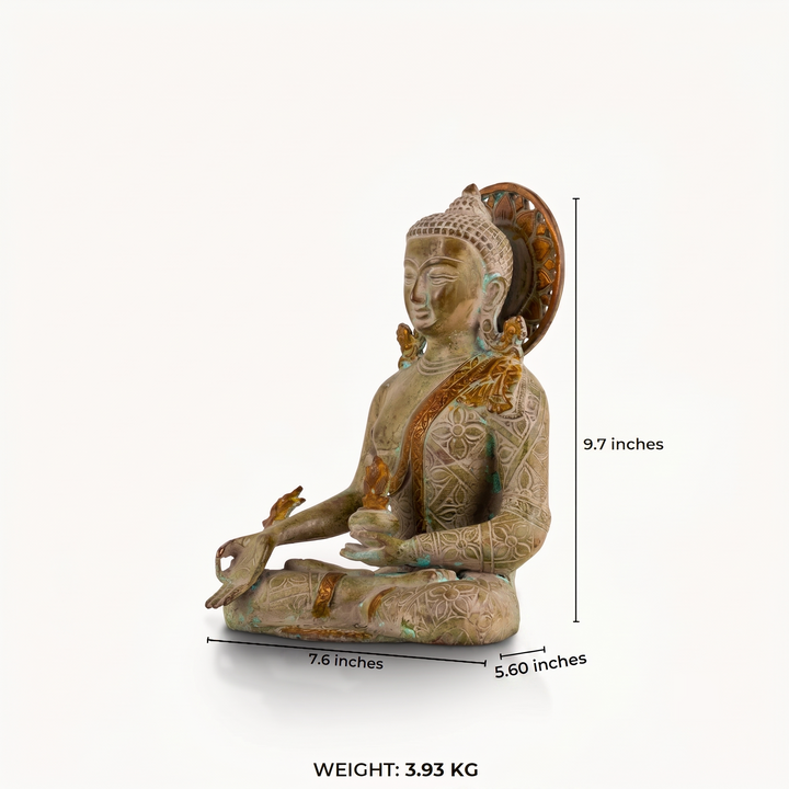 Patterned verdigris brass Buddha statue with deeply engraved robes and a pierced halo.