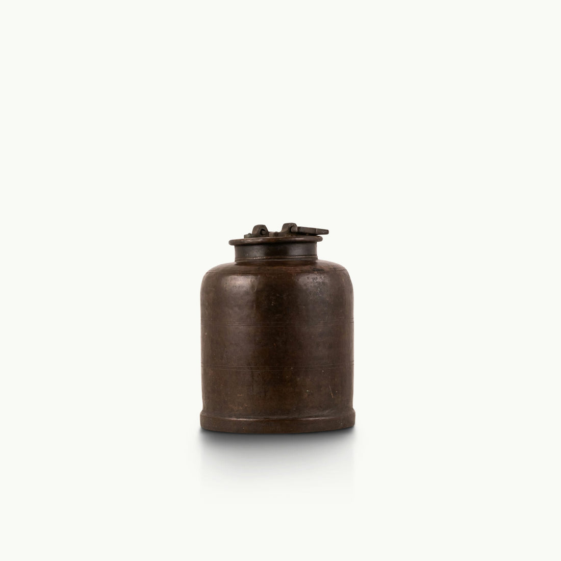 Antique Brass Canister secured by mechanical latches for a wood sideboard.