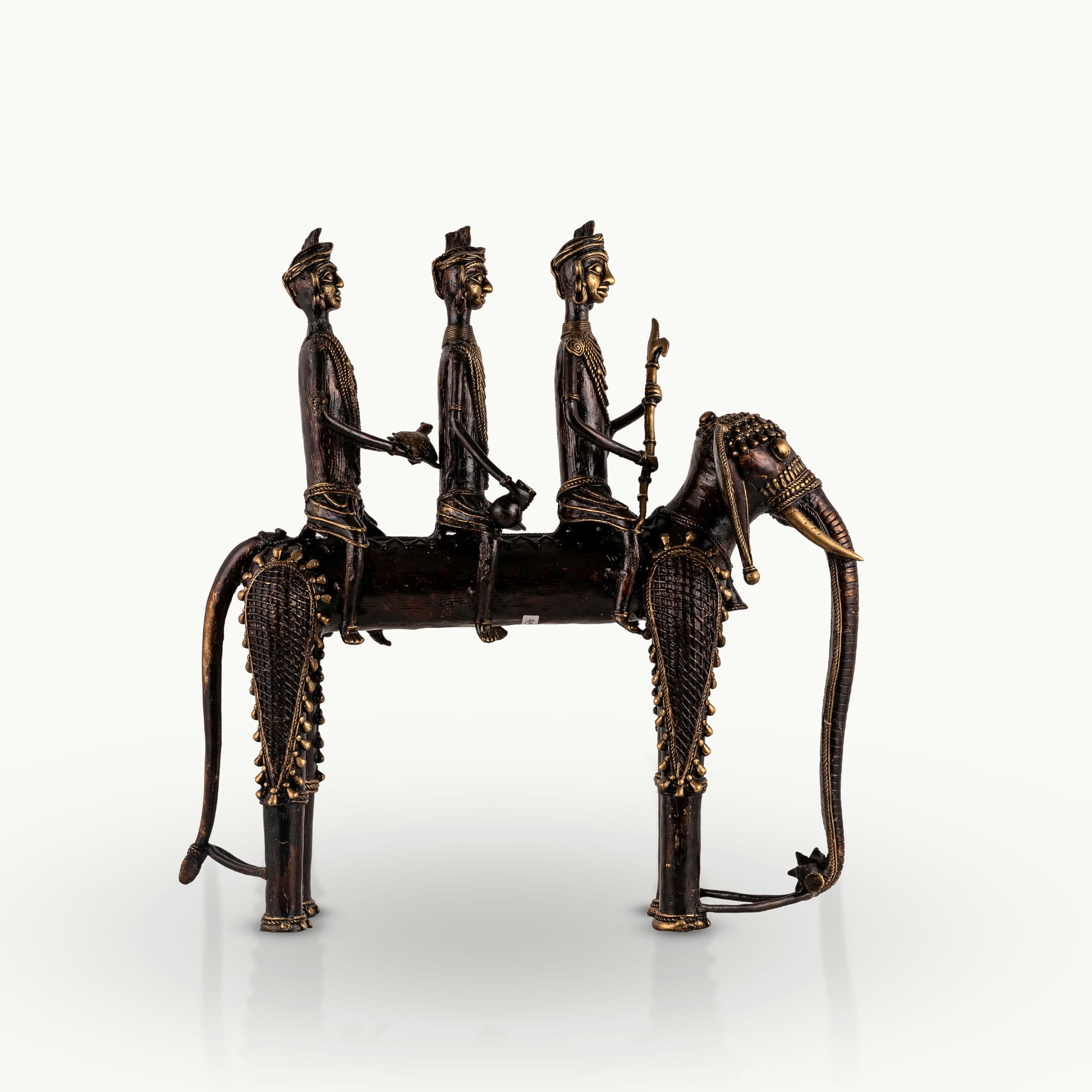 Dhokra Brass Processional Elephant Sculpture carrying three riders for a rustic wooden console
