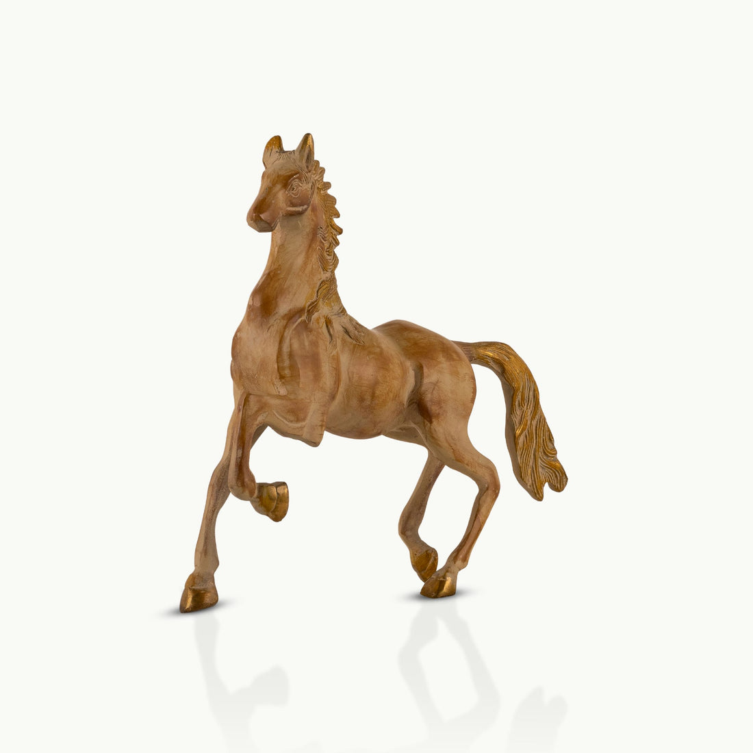 Antique resin-cast stylized horse figurine with gilded mane and tail
